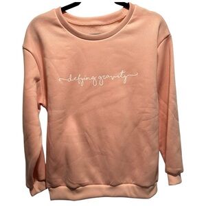 NWOT 'defying gravity' Crewneck Sweatshirt Size Medium